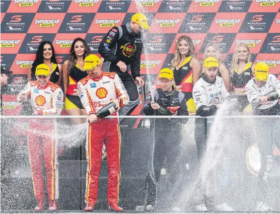  ?? Picture / AAP ?? Fabian Coulthard (front) has grabbed the overall Supercars lead but had to concede victory at Bathurst yesterday to David Reynolds (centre).