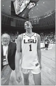  ?? AP/BILL FEIG ?? LSU guard Javonte Smart celebrates after LSU defeated Tennessee 82-80 in overtime on Saturday. LSU, Tennessee and Kentucky are tied for the lead in the SEC standings at 12-2 with four games to play.