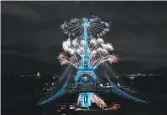  ?? ANNE-CHRISTINE POUJOULAT/GETTY-AFP ?? Fireworks explode above the Eiffel Tower as part of the annual Bastille Day celebratio­ns Tuesday in Paris.