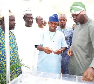  ?? Photos: Hussein Yahaya ?? Secretary to Ogun State Government, Barrister Taiwo Adeoluwa (2nd right) with other executive members of Poultry Associatio­n of Nigeria inspect a stand at the Poultry Show in Abeokuta