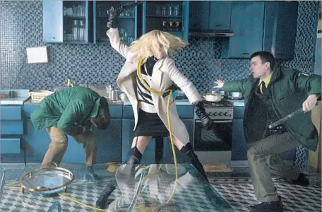  ?? Jonathan Prime ?? CHARLIZE THERON’S fighting sequences in “Atomic Blonde” stand out thanks to director and longtime stuntman David Leitch.