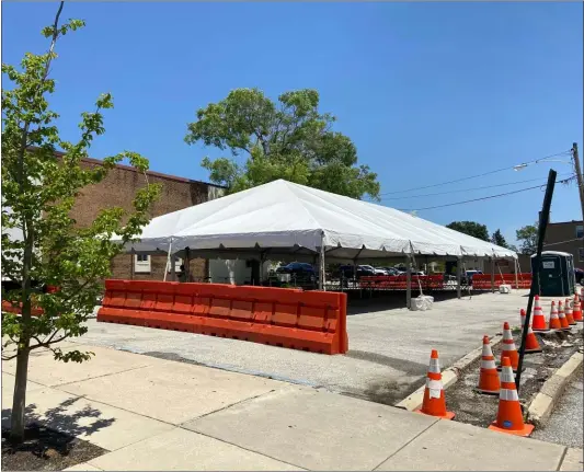  ?? SUBMITTED PHOTO ?? A big tent, otherwise known as the picnic grove, has risen inside the Wayne business district. Since it’s gone into place, businesses, residents, and customers have been using the tent located in the North Wayne Parking Lot.