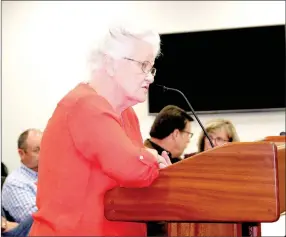  ?? LYNN KUTTER ENTERPRISE-LEADER ?? Linda Lee of Farmington speaks against a large-scale developmen­t plan to park fuel trucks on South Hunter Street behind Tobacco Discount. Farmington Planning Commission voted against the proposal.