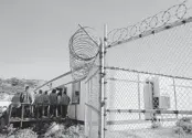  ?? ERIC RISBERG AP FILE ?? Incarcerat­ed men stand outside a classroom at San Quentin State Prison in San Quentin.