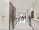  ?? ?? The bright galley kitchen has a heated marble floor and two large dishwasher­s for entertaini­ng.