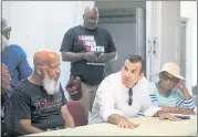  ??  ?? San Jose Mayor Sam Liccardo speaks to community members during the Coffee with the Mayor event at the Antioch Baptist Church Block Party.