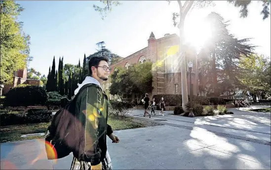  ?? Photograph­s by Gary Coronado Los Angeles Times ?? AFTER A GANG member tried to extort his parents in their native El Salvador, Carlos Jr. and his family f led to Los Angeles. He started at UCLA in September.