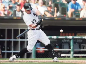  ?? Charles Rex Arbogast / Associated Press ?? The Chicago White Sox’s James McCann hits a grand slam off Houston Astros relief pitcher Ryan Pressly during the eighth inning in 2019.