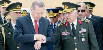  ?? AFP file photo ?? THE POWER PUZZLE... Turkish Prime Minister Recep Tayyip Erdogan speaks to Chief of Staff General Necdet Ozel before a meeting of the High Military Council in Ankara. —