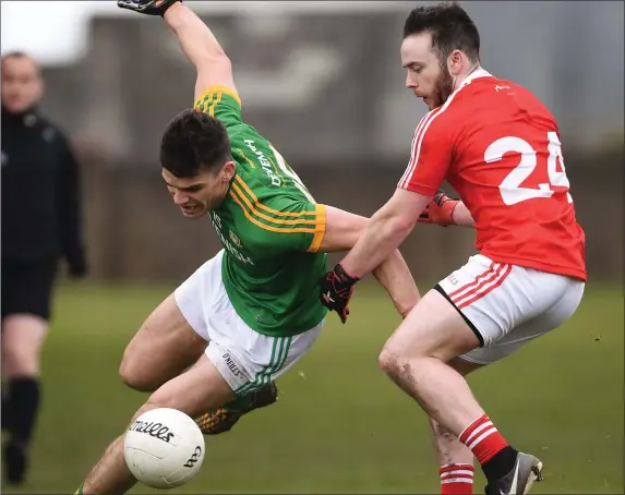  ??  ?? Donal Lenihan of Meath is tackled by Andrew Smyth of Louth during the Allianz League clash at Drogheda on Saturday.