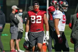  ?? Associated Press photo ?? Tampa Bay Buccaneers tight end Antony Auclair, of Canada, watches the special teams during an NFL football practice Jan. 6.