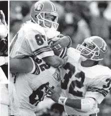  ?? DENVER POST PHOTO VIA GETTY IMAGES ?? AN UNFORGETTA­BLE RUN: Quincy’s Joe Dudek, right, celebrates with teammates in his brief stint with the Broncos as a replacemen­t player during the 1987 NFL strike. At left, Dudek bowls through Bridgewate­r State players in his senior season at Plymouth...