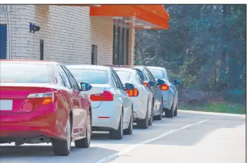  ?? Tribune News Service ?? If sitting in line seems like a long time, shut the car engine down. It does not take more gas to restart the engines.