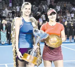  ?? — AFP photo ?? Julia Goerges of Germany (L) poses with the winner’s trophy with runner-up Bianca Andreescu of Canada (R) following the women’s singles final match at the ASB Classic tennis tournament in Auckland on January 6, 2019.