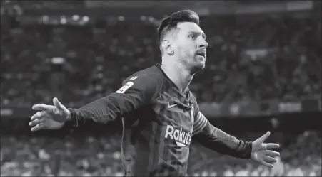 ?? REUTERS ?? Barcelona’s Lionel Messi celebrates completing his hat-trick — the 51st of his career — in a 4-1 victory over Real Betis at Estadio Benito Villamarin in Seville on Sunday.