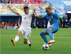  ?? AP ?? Brazil forward Neymar ( right) tries to dodge past Costa Rica’s Johnny Acosta in their Group E match at the St Petersburg Stadium on Friday. —