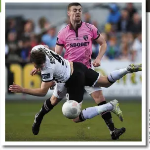  ??  ?? David McMillan is brought to ground by Wexford Youths’ Craig McCabe during Sunday’s clash at Oriel Park.