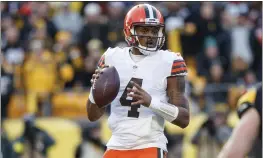  ?? MATT DURISKO — THE ASSOCIATED PRESS FILE ?? Cleveland Browns quarterbac­k Deshaun Watson looks to pass during a game on Jan. 8 in Pittsburgh, Pa. Cleveland general manager Andrew Berry indicated, Tuesday, the team may restructur­e the five-year, $230million deal it used to entice Watson to agree to a trade from Houston to the Browns one year ago.