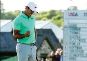  ??  ?? BROOKS KOEPKA REACTS ON THE 18TH HOLE during the fourth round of the U.S. Open on Sunday at Erin Hills in Erin, Wis.