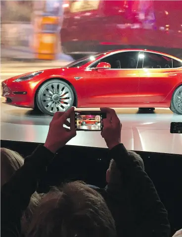  ?? JUSTIN PRITCHARD / THE ASSOCIATED PRESS FILES ?? CEO Elon Musk recently said the Model 3 Tesla production lines will be “be roughly comparable with the best high-volume vehicle production lines in the world.”