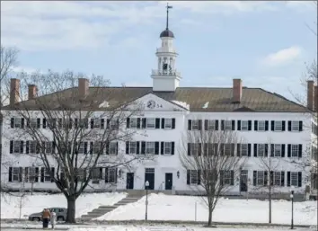  ?? Caleb Kenna/The New York Times ?? The snow-covered Dartmouth Hall on the college’s campus in Hanover, N.H., last month.