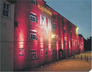  ??  ?? The Mill Arts Centre in Banbury was lit in red last month to highlight the plight of the industry