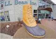  ?? [AP FILE PHOTO] ?? Shoppers exit the L.L. Bean retail store in Freeport, Maine. L.L. Bean is tightening its generous return policy by imposing a one-year limit on most returns to reduce abuse and fraud. Executives say returns of severely worn items have doubled over five...