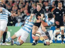  ?? Photo: FAIRFAX NZ ?? Body collision: The moment when All Black first-five eighth
Colin Slade suffered his tournament-ending groin injury in the quarterfin­al of the Rugby World Cup against Argentina at Eden Park.