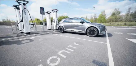  ?? CHRISTOPHE­R FURLONG/GETTY ?? A Hyundai Ioniq battery electric vehicle charges at an Ionity GmbH electric car charging station April 26 in Leeds, England.