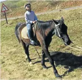  ?? Pictures: Thembekile Vokwana ?? CHECK MATES Wanda Vokwana, 7, and Elona Vokwana, 3, try out some of the horsey activities at the hotel.