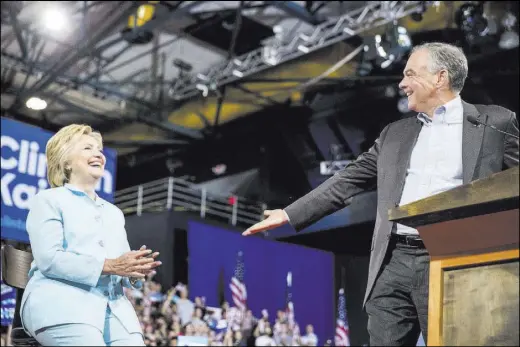  ?? ANDREW HARNIK/THE ASSOCIATED PRESS ?? Democratic presidenti­al candidate Hillary Clinton and Sen. Tim Kaine, D-Va., appear at a rally at Florida Internatio­nal University Panther Arena in Miami on Saturday. Clinton has chosen Kaine to be her running mate.