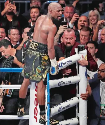  ?? ERIC JAMSION/AP PHOTO ?? Floyd Mayweather Jr. celebrates after defeating Conor McGregor on Saturday night in Las Vegas.