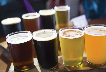  ?? GETTY IMAGES ?? A small beer tasting party at home with family is a great way to learn more about craft beer and socialize, too.