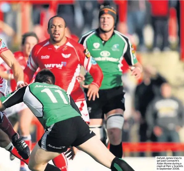  ??  ?? Dafydd James tries to get past Connacht’s Aidan Wynne during a clash at Parc y Scarlets in September 2008.
