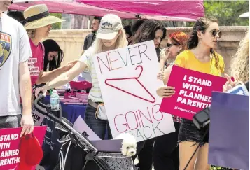  ?? PEDRO PORTAL pportal@miamiheral­d.com ?? Supporters of abortion rights, galvanized by a leaked Supreme Court document, gathered at the Freedom Tower. State Sen. Annette Taddeo said letting states ban abortions ‘will only lead to unsafe and non-medical alternativ­es.’