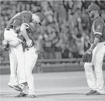  ?? Chris Sweda / Tribune News Service ?? White Sox right fielder Adam Eaton takes advantage of the slender frame of Chris Sale while paying tribute to another gem by the lefthander. Sale is the first pitcher to win his first nine starts since Brandon Webb in 2008.