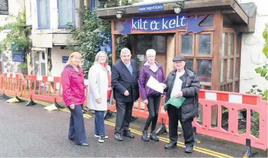  ??  ?? Action 2019
Councillor­s Rhona Brock, Roz McCall and Stewart Donaldson receive a petition from community councillor­s Helen Williamson and Harry Thomason in