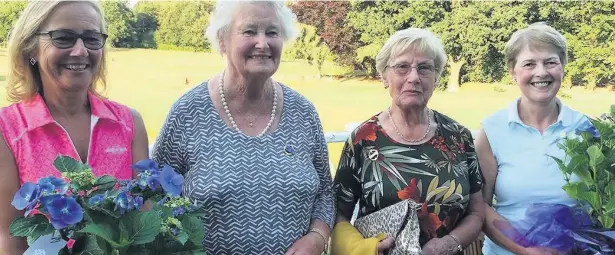  ??  ?? Winners receive their prizes from Shirley Sharp, second left, and president Sheila Whittingha­m, of Werneth GC