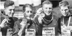  ??  ?? Chris Walker-Hebborn, Adam Peaty, James Guy and Duncan Scott of Britain (silver) pose with medals. — Reuters photo