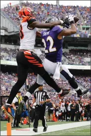  ?? AP PHOTO ?? Baltimore Ravens cornerback Jimmy Smith intercepts a pass in the end zone intended for Cincinnati Bengals wide receiver A.J. Green.