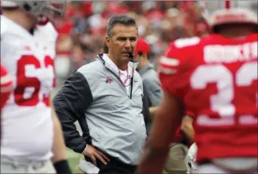  ?? JAY LAPRETE — THE ASSOCIATED PRESS ?? Ohio State head coach Urban Meyer said he thought last season’s team made it to the playoffs a year ahead of schedule. With J.T. Barrett running the offense and one of the best defenses in the nation, Ohio State expects nothing less than to be in the...