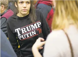  ?? DAVID GOLDMAN/ASSOCIATED PRESS ARCHIVES ?? A woman wears a “Trump Putin ‘16” shirt while waiting for Donald Trump to speak at a campaign event in February at Plymouth State University in Plymouth, New Hampshire.