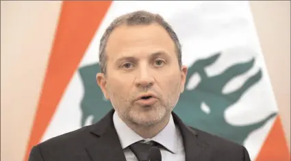  ?? -AFP ?? Lebanese Foreign Minister Gebran Bassil has been invited to take part in a talk at Davos on unrest in the Arab world, causing anger among those who support the three-months-old anti-government protest movement.