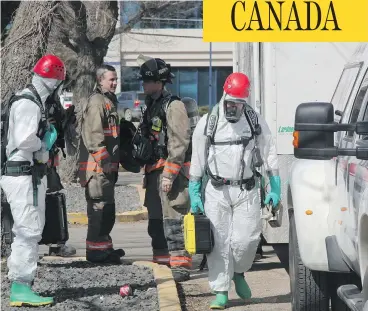  ?? MORGAN MODJESKI / POSTMEDIA NEWS FILES ?? Saskatoon firefighte­rs respond to a suspicious package containing a harmless white powder at the Saskatoon Inn and Suites in April. A Saskatoon woman has been charged with a string of bizarre incidents involving white powder.