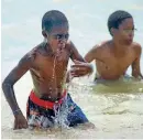  ?? CHIEFTAIN FILE PHOTO ?? In this Chieftain file photo from 2013, Tommy Fagan, 11, left, takes a deep breath as he emerges from the shallow water at Lake Pueblo State Park. His brother, Evan Steele, 11, also enjoys the cool water.