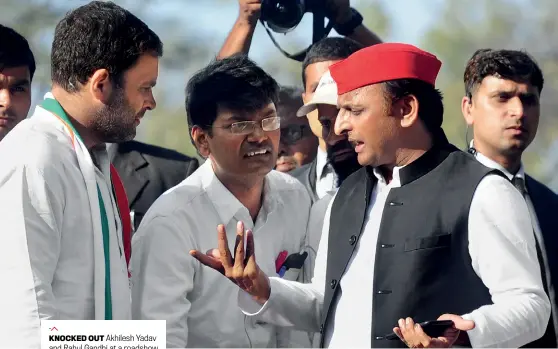  ?? AFP ?? KNOCKED OUT Akhilesh Yadav and Rahul Gandhi at a roadshow in Allahabad on February 21