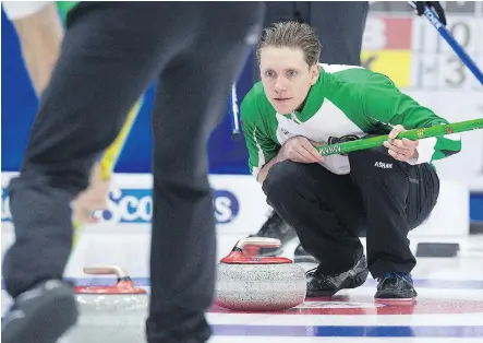  ?? ANDREW VAUGHAN/THE CANADIAN PRESS ?? Saskatchew­an skip Adam Casey watches a rock during his match against Brendan Bottcher’s Alberta rink at the Brier in St. John’s, N.L., on Sunday. Casey’s rink won the game 11-5, and will bring a 2-1 mark into its first match on Monday, against Quebec.
