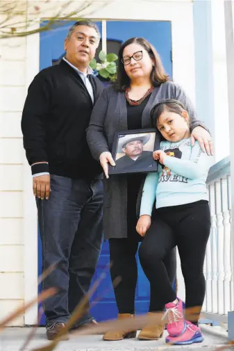  ?? Scott Strazzante / The Chronicle ?? Veronica Hernández with husband Juan and daughter Emanelli at their Santa Rosa home. The family said goodbye by Zoom as Hernández’s uncle, José Jesús Arroyo, was dying of COVID19.