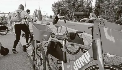  ?? San Francisco Chronicle file photo ?? Electric bikes and scooters have been used for years in the municipal bike-sharing program in Sacramento, Calif.