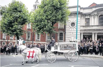  ??  ?? ●●Crowds outside Stockport Town Hall watched the funeral service on a big screen PICS JOEL GOODMAN